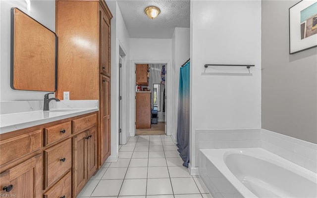 106 Edith Wharton Sq, Newport News, VA 23606 - full bath with tile patterned floors, vanity, a bath, and a textured ceiling
