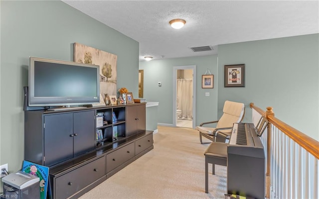 106 Edith Wharton Sq, Newport News, VA 23606 - sitting room with light colored carpet, a textured ceiling, and baseboards