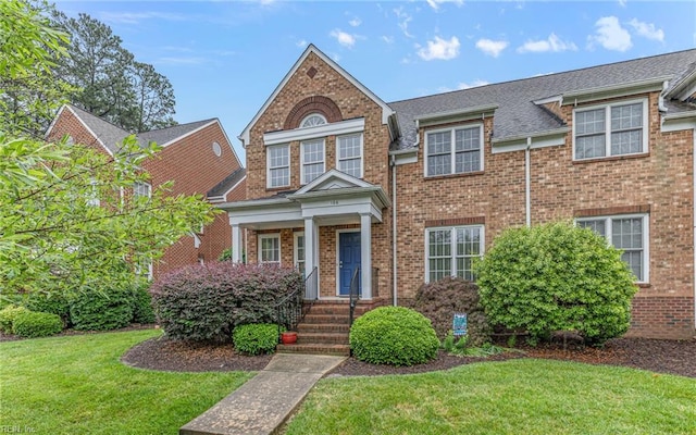 106 Edith Wharton Sq, Newport News, VA 23606 - view of front facade with a front lawn and brick siding