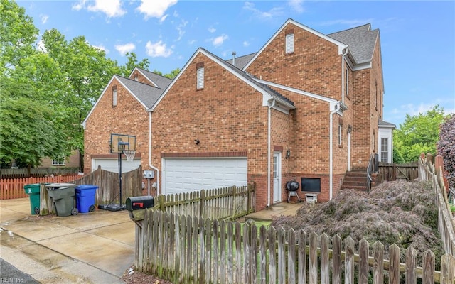 106 Edith Wharton Sq, Newport News, VA 23606 - view of home's exterior featuring brick siding, a shingled roof, and an attached garage
