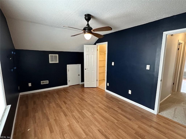 2304 Londale Ct, Virginia Beach, VA 23456 - unfurnished bedroom featuring vaulted ceiling, baseboards, light wood-style floors, a textured ceiling, and ceiling fan