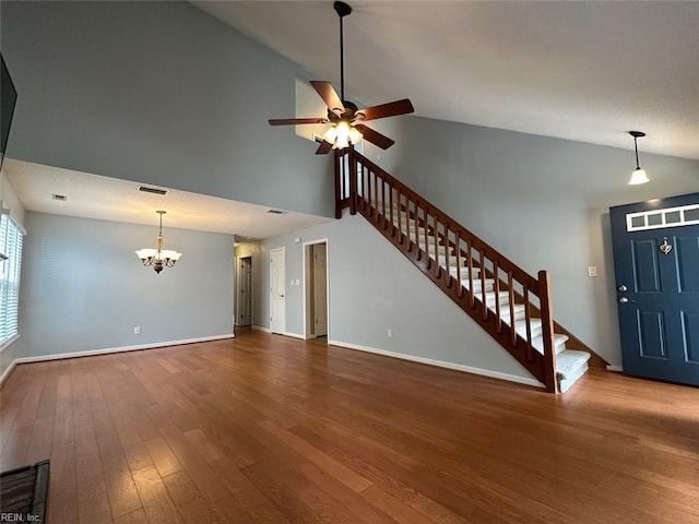 2304 Londale Ct, Virginia Beach, VA 23456 - unfurnished living room with a chandelier, high vaulted ceiling, stairway, ceiling fan, and wood finished floors