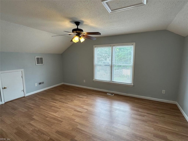 2304 Londale Ct, Virginia Beach, VA 23456 - additional living space featuring lofted ceiling, a textured ceiling, ceiling fan, wood finished floors, and baseboards
