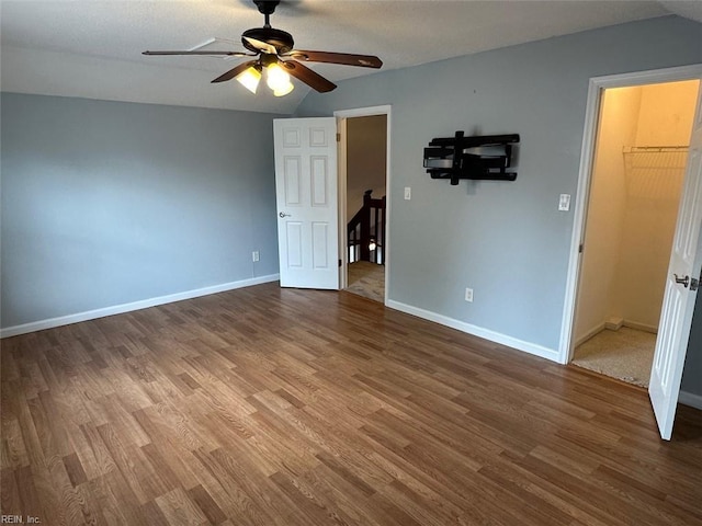 2304 Londale Ct, Virginia Beach, VA 23456 - unfurnished room with wood finished floors, a ceiling fan, baseboards, and vaulted ceiling