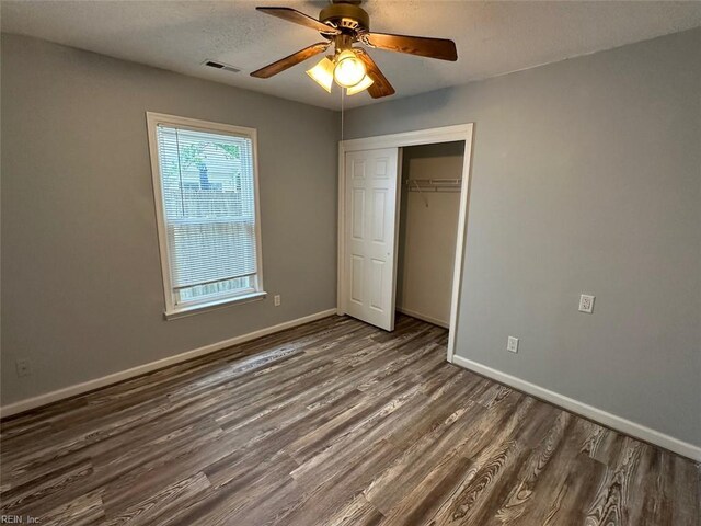 2304 Londale Ct, Virginia Beach, VA 23456 - unfurnished bedroom with wood finished floors, baseboards, a closet, ceiling fan, and a textured ceiling