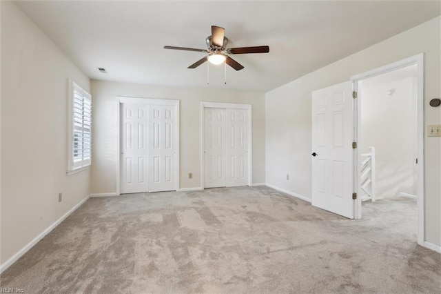 947 Willow Pt, Newport News, VA 23602 - unfurnished bedroom with two closets, carpet, baseboards, and a ceiling fan