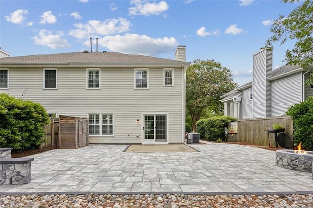 947 Willow Pt, Newport News, VA 23602 - rear view of property featuring an outdoor fire pit, a patio area, central air condition unit, and a fenced backyard