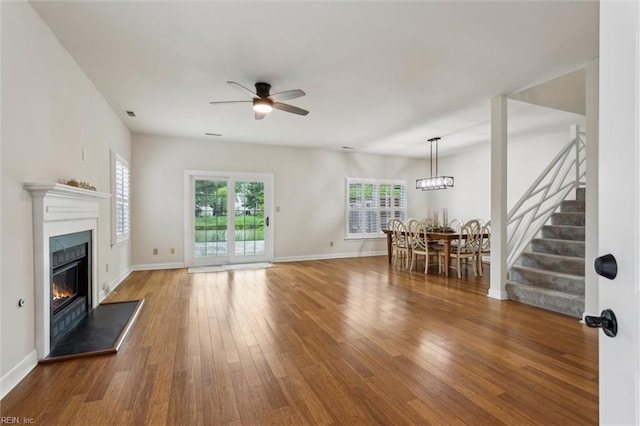 947 Willow Pt, Newport News, VA 23602 - living room with a ceiling fan, stairs, a glass covered fireplace, and hardwood / wood-style flooring