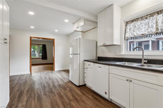 702 Blair Ave, Hampton, VA 23661 - kitchen featuring white appliances, a sink, dark wood-style floors, dark countertops, and white cabinetry