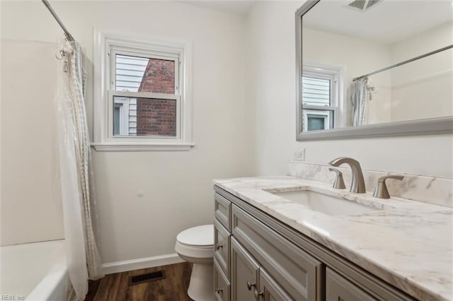 702 Blair Ave, Hampton, VA 23661 - full bath with vanity, toilet, plenty of natural light, and baseboards