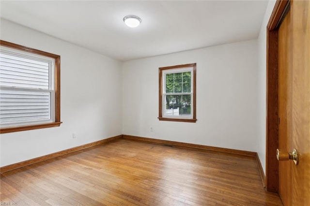 702 Blair Ave, Hampton, VA 23661 - unfurnished bedroom with light wood-type flooring and baseboards