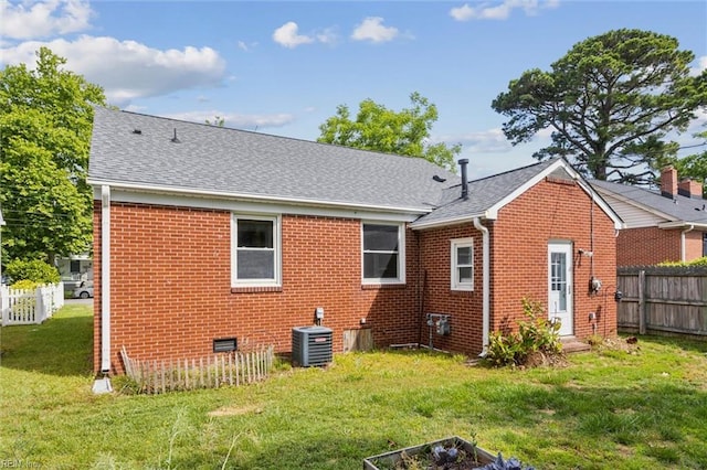 702 Blair Ave, Hampton, VA 23661 - rear view of house with cooling unit, brick siding, and roof with shingles