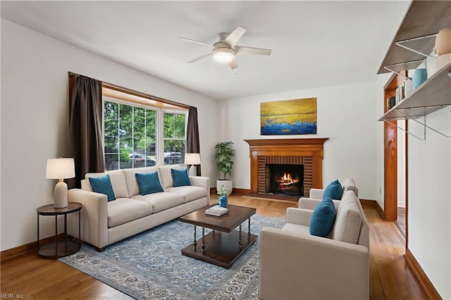 702 Blair Ave, Hampton, VA 23661 - living room with wood finished floors, baseboards, a ceiling fan, and a fireplace