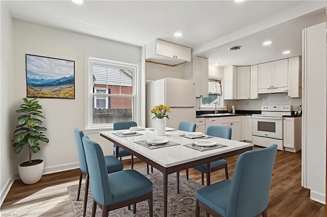 702 Blair Ave, Hampton, VA 23661 - dining area with wood finished floors, baseboards, and recessed lighting