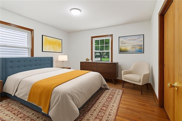 702 Blair Ave, Hampton, VA 23661 - bedroom with light wood finished floors and baseboards