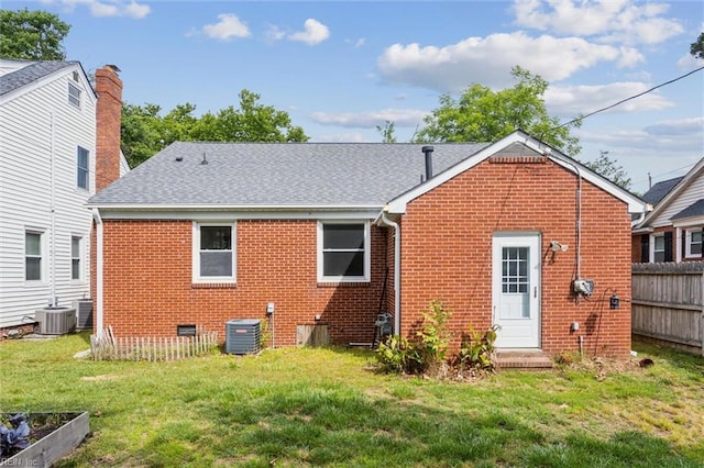702 Blair Ave, Hampton, VA 23661 - rear view of house featuring brick siding, a lawn, central air condition unit, and a shingled roof