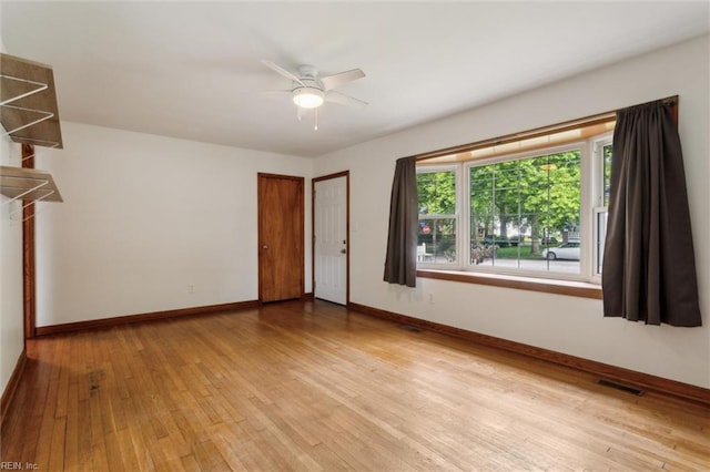 702 Blair Ave, Hampton, VA 23661 - unfurnished room featuring baseboards, light wood-style flooring, and a ceiling fan