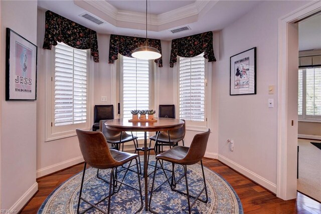 509 River Blfs, Williamsburg, VA 23185 - dining space with a tray ceiling, wood finished floors, ornamental molding, and baseboards