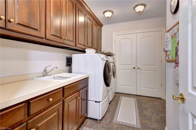 509 River Blfs, Williamsburg, VA 23185 - laundry area featuring separate washer and dryer, cabinet space, and dark tile patterned flooring