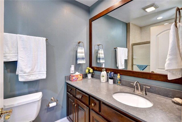 509 River Blfs, Williamsburg, VA 23185 - bathroom featuring toilet, vanity, and baseboards