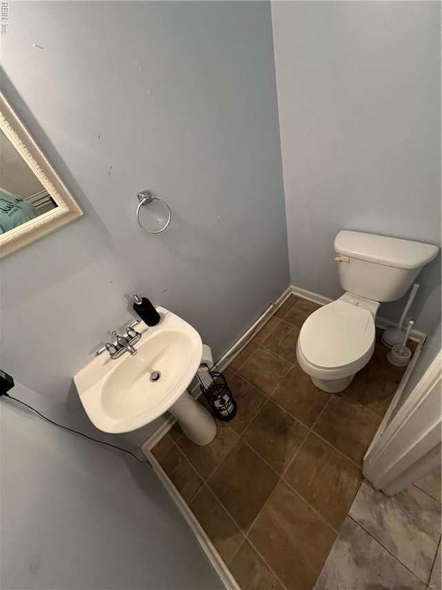 327 Nassau Pl, Hampton, VA 23666 - half bathroom with toilet, tile patterned floors, and a sink