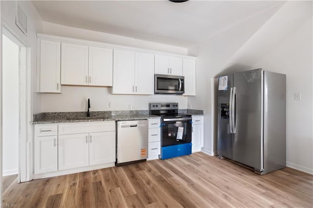 3711 Abingdon Cir, Norfolk, VA 23513 - kitchen with appliances with stainless steel finishes, a sink, light wood-style floors, stone countertops, and white cabinets
