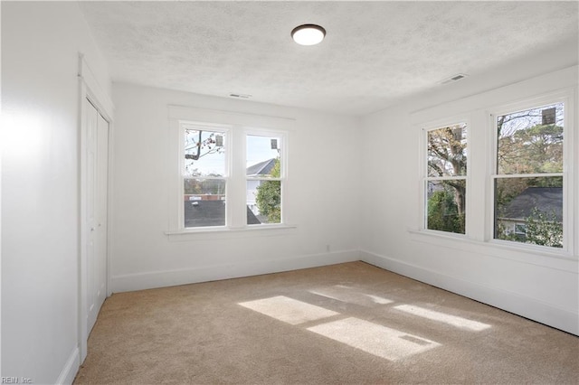 3711 Abingdon Cir, Norfolk, VA 23513 - empty room featuring a textured ceiling, carpet floors, and baseboards