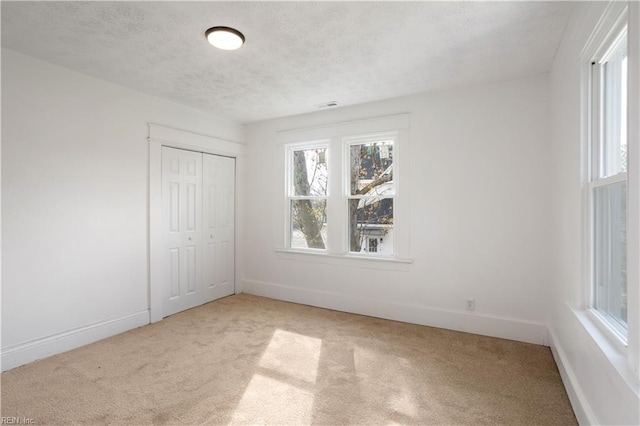 3711 Abingdon Cir, Norfolk, VA 23513 - unfurnished bedroom with light carpet, baseboards, and a textured ceiling