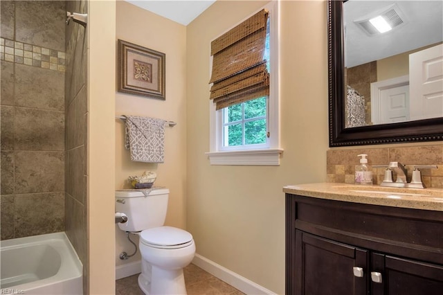 210 John Pott Dr, Williamsburg, VA 23188 - full bathroom with vanity, baseboards, toilet, tasteful backsplash, and tile patterned flooring