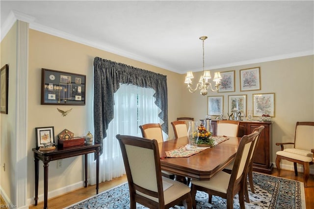 210 John Pott Dr, Williamsburg, VA 23188 - dining space featuring a chandelier, wood finished floors, ornamental molding, and baseboards