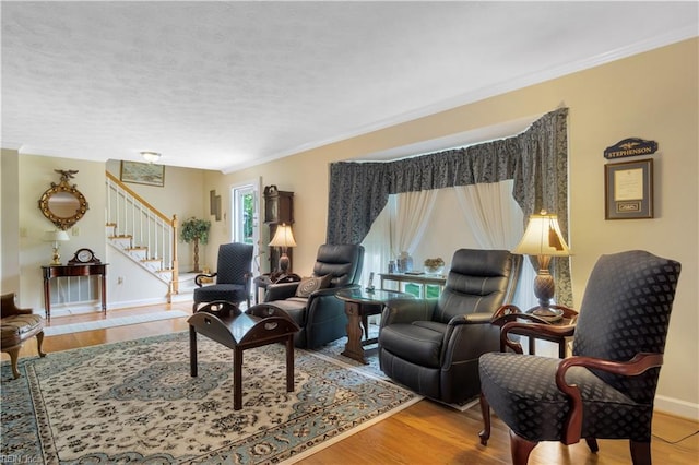 210 John Pott Dr, Williamsburg, VA 23188 - living area featuring stairway, ornamental molding, wood finished floors, a textured ceiling, and baseboards