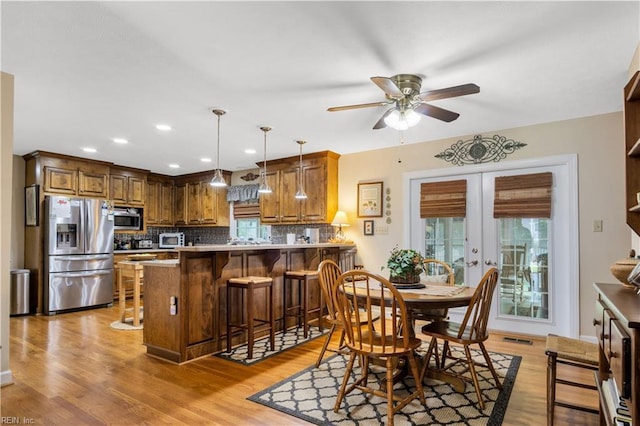 210 John Pott Dr, Williamsburg, VA 23188 - dining room featuring ceiling fan, light wood-style floors, recessed lighting, and french doors