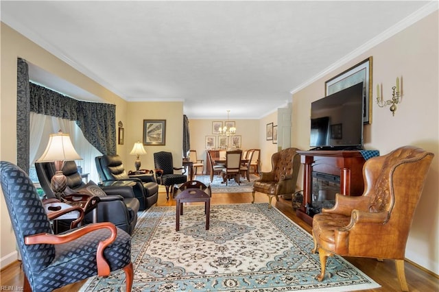 210 John Pott Dr, Williamsburg, VA 23188 - living area featuring a chandelier, wood finished floors, crown molding, a fireplace, and baseboards