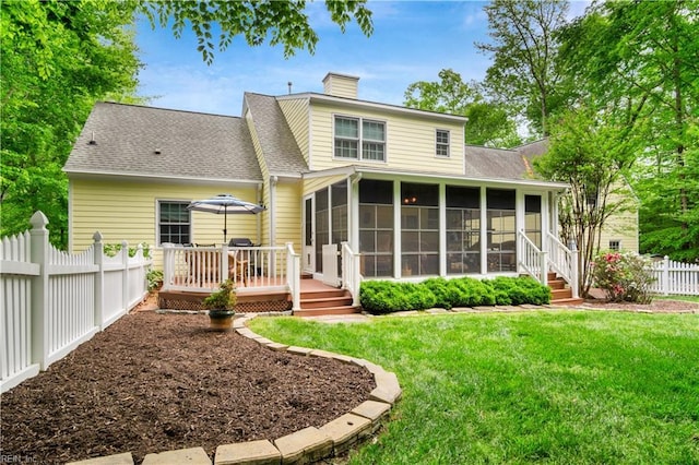 210 John Pott Dr, Williamsburg, VA 23188 - back of property with a sunroom, a chimney, a deck, and roof with shingles