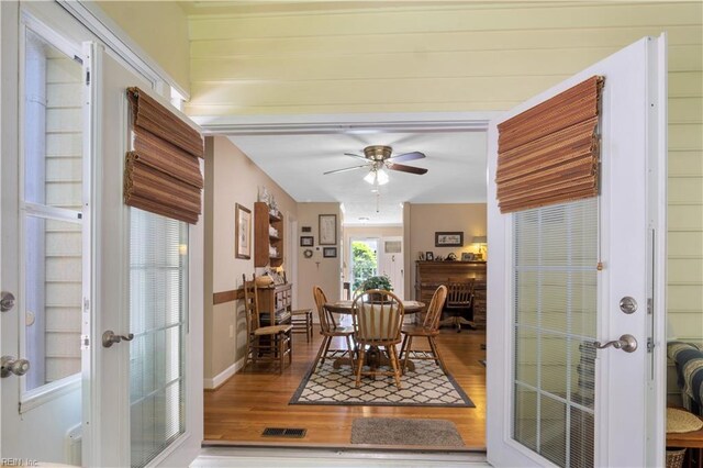 210 John Pott Dr, Williamsburg, VA 23188 - dining space featuring wood finished floors, ceiling fan, and french doors