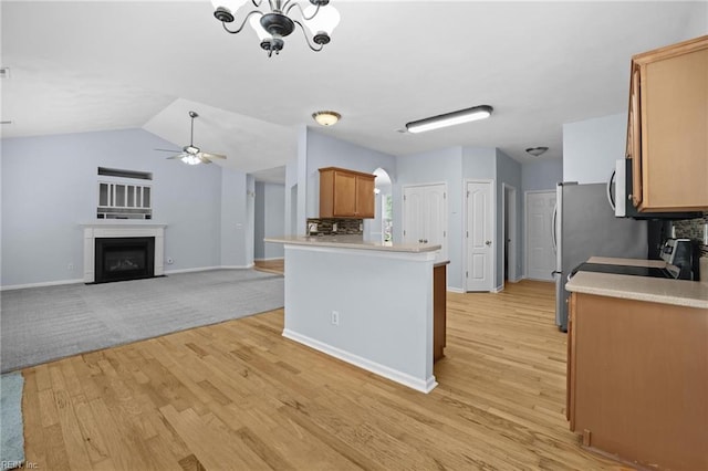 2110 King St, Suffolk, VA 23434 - kitchen with light wood-type flooring, a ceiling fan, light countertops, baseboards, and a fireplace with flush hearth