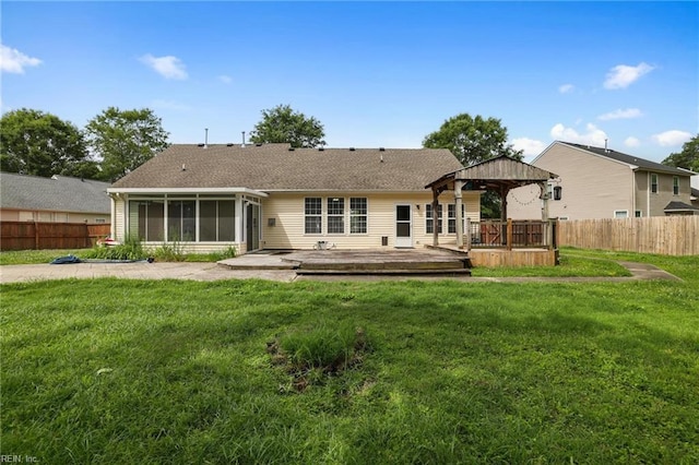 2110 King St, Suffolk, VA 23434 - back of property featuring a gazebo, a sunroom, a deck, and roof with shingles
