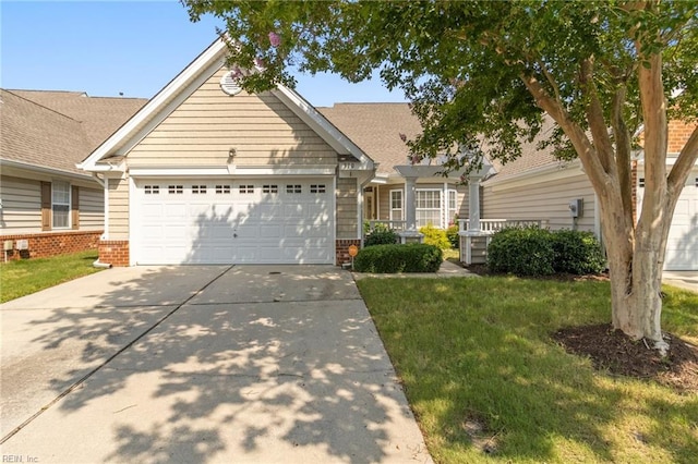 310 Lighthouse Way, Carrollton, VA 23314 - view of front of house with concrete driveway, brick siding, a garage, and a front lawn
