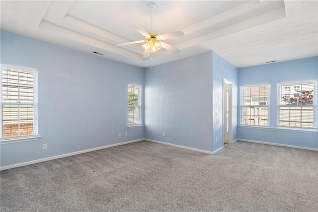 310 Lighthouse Way, Carrollton, VA 23314 - empty room featuring carpet, a tray ceiling, and baseboards