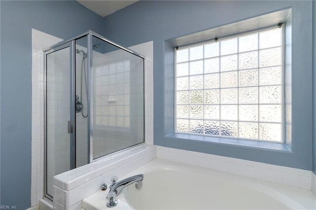 310 Lighthouse Way, Carrollton, VA 23314 - full bath with a garden tub, a stall shower, and plenty of natural light