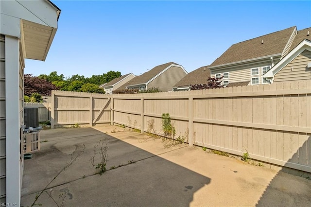 310 Lighthouse Way, Carrollton, VA 23314 - fenced backyard featuring a patio area and central AC