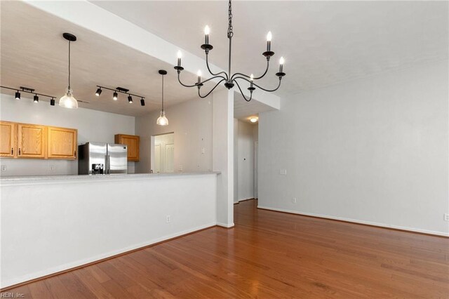 310 Lighthouse Way, Carrollton, VA 23314 - kitchen featuring stainless steel fridge, wood finished floors, a chandelier, and light countertops