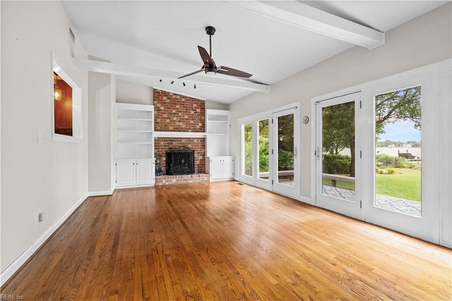 6414 Wythe Pl, Norfolk, VA 23508 - unfurnished living room featuring wood finished floors, ceiling fan, built in shelves, baseboards, and a fireplace