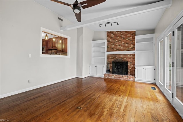 6414 Wythe Pl, Norfolk, VA 23508 - unfurnished living room featuring ceiling fan, wood finished floors, a brick fireplace, and baseboards