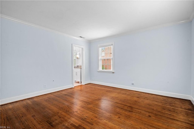 6414 Wythe Pl, Norfolk, VA 23508 - spare room featuring ornamental molding, baseboards, and wood finished floors