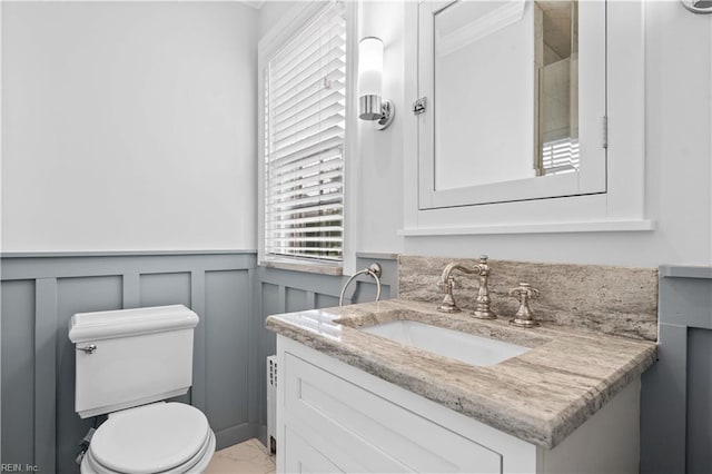 6414 Wythe Pl, Norfolk, VA 23508 - bathroom with vanity, toilet, a wainscoted wall, marble finish flooring, and a decorative wall
