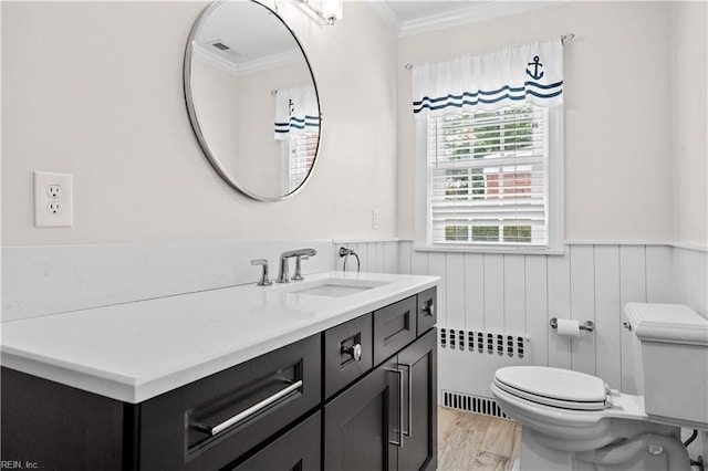 6414 Wythe Pl, Norfolk, VA 23508 - bathroom with crown molding, radiator, toilet, vanity, and a wainscoted wall