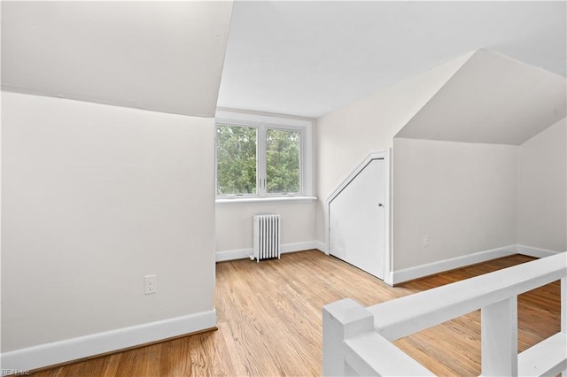 6414 Wythe Pl, Norfolk, VA 23508 - additional living space featuring radiator, baseboards, wood finished floors, and lofted ceiling