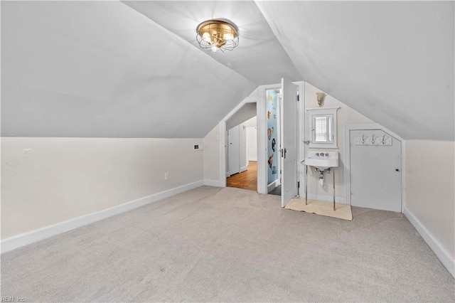 6414 Wythe Pl, Norfolk, VA 23508 - bonus room featuring carpet floors, vaulted ceiling, baseboards, and a sink