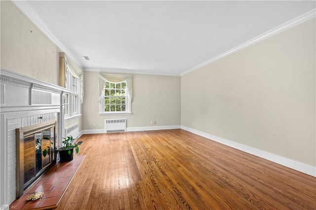 6414 Wythe Pl, Norfolk, VA 23508 - unfurnished living room featuring radiator heating unit, a brick fireplace, crown molding, wood finished floors, and baseboards